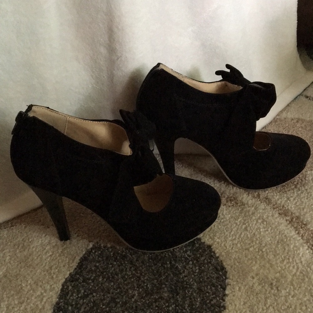Black suede booties with bow.